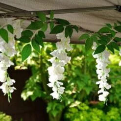 Solar Powered 180cm Artificial Leaf Garland With Wisteria Flowers - Warm White -Garden Furniture Store 379258 180cm solar powered artificial leaf garland with wisteria flowers 20 warm white micro leds